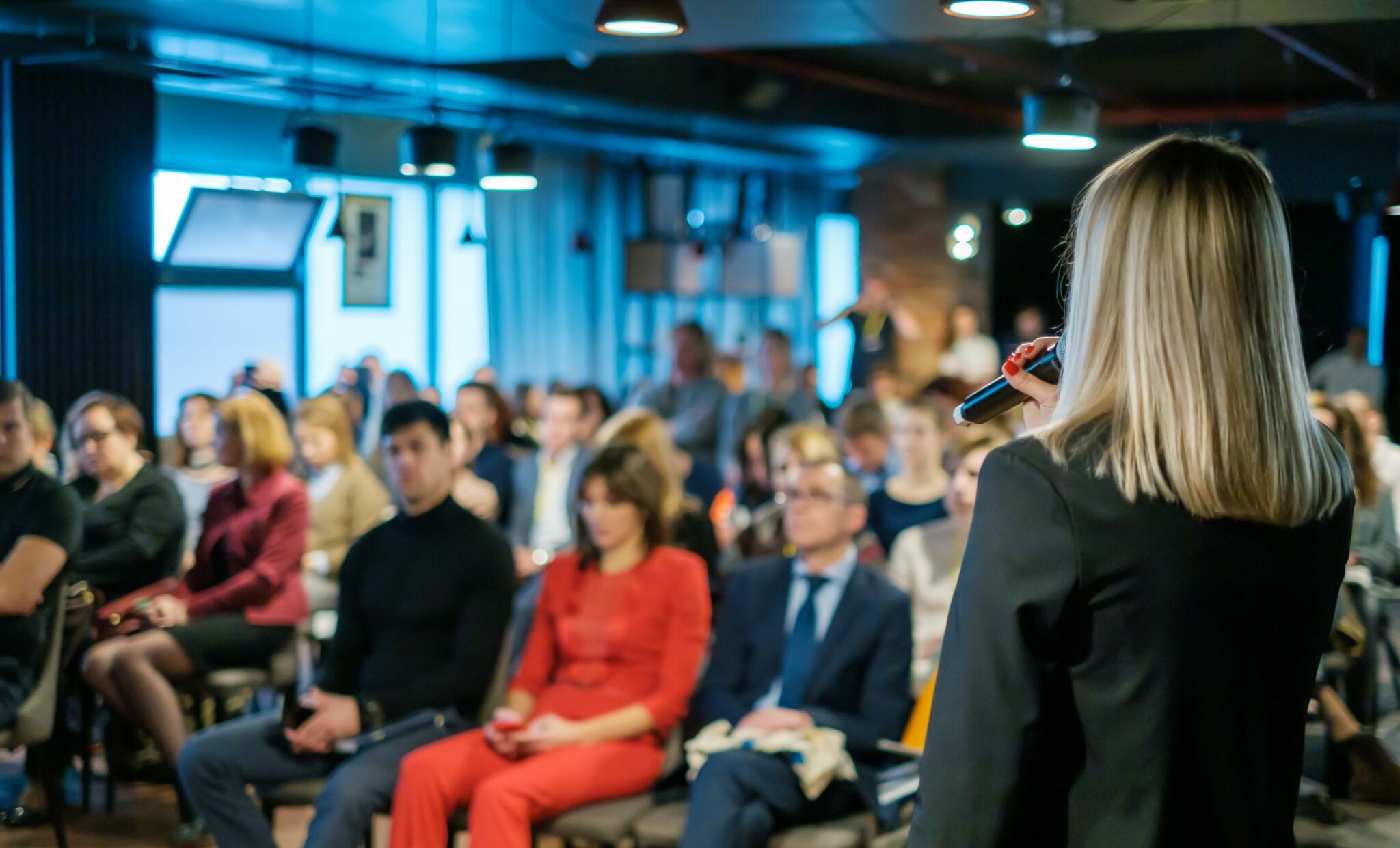 Female Presenter Presenting to audience